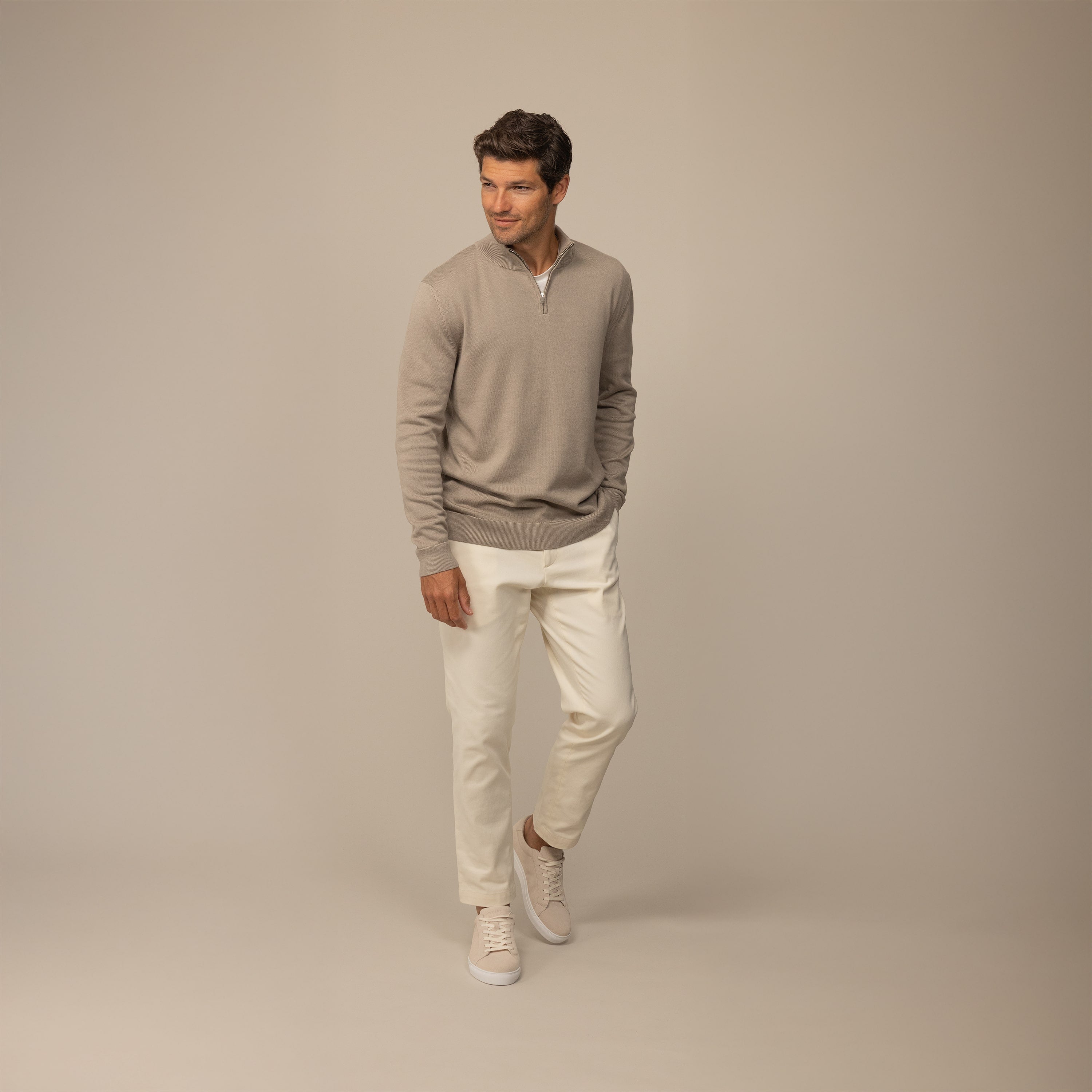 Man wearing a putty dove half zip jumper, front view.