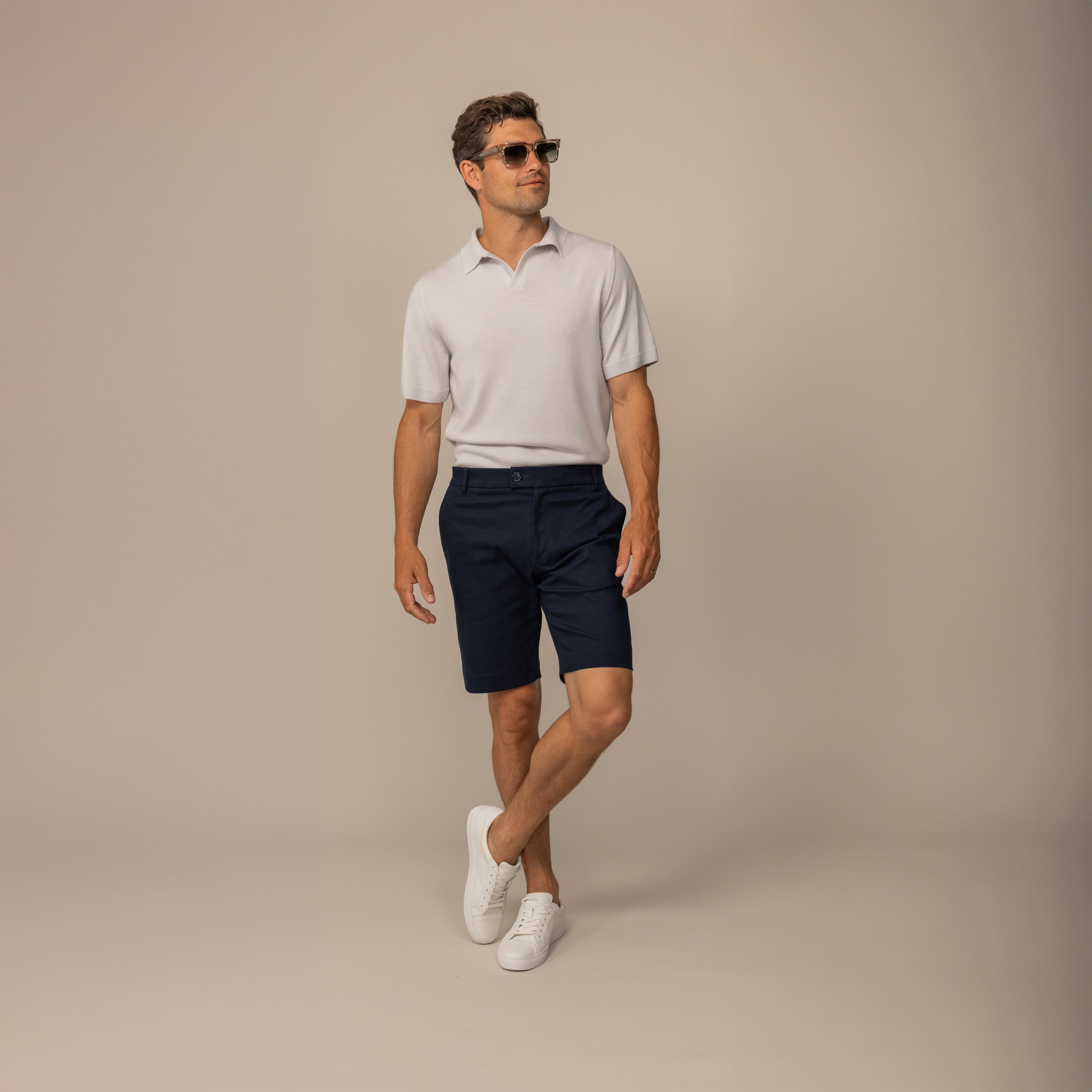 Man wearing Chino Shorts in Navy, front view.
