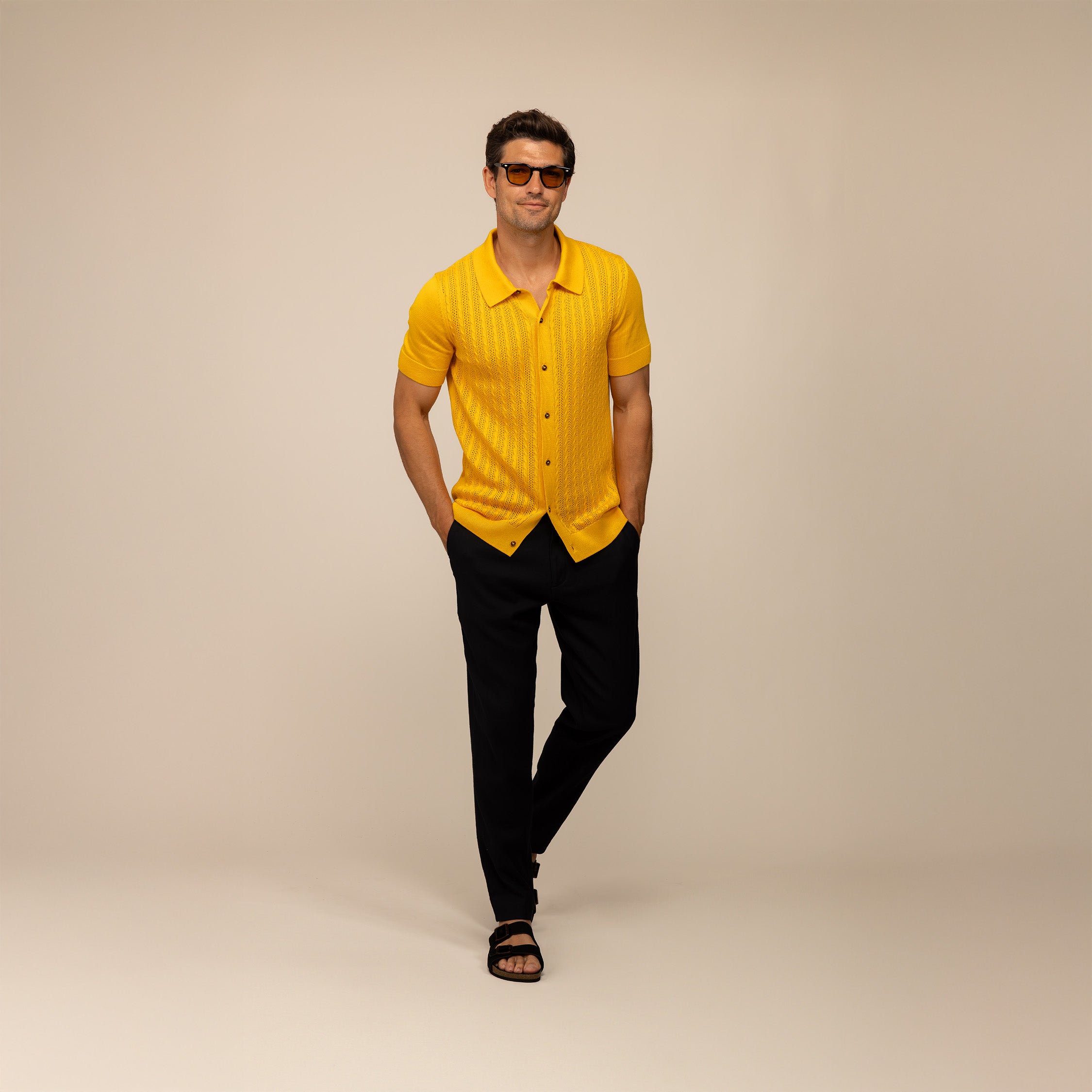 Man wearing Marame cabe knit shirt in citrus, front view.