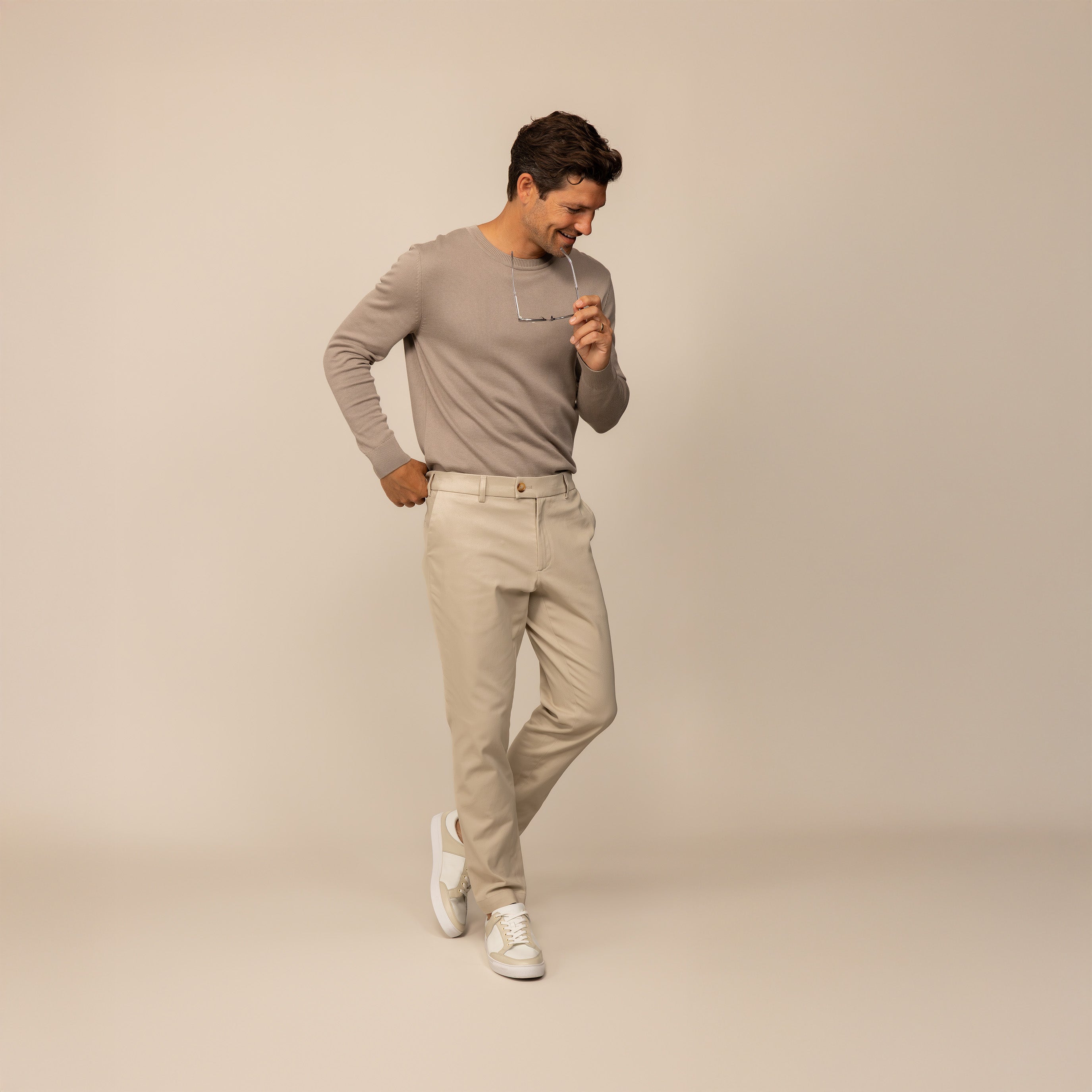 Man wearing a Fine Knit Crew Neck Jumper in Putty Dove, front view.