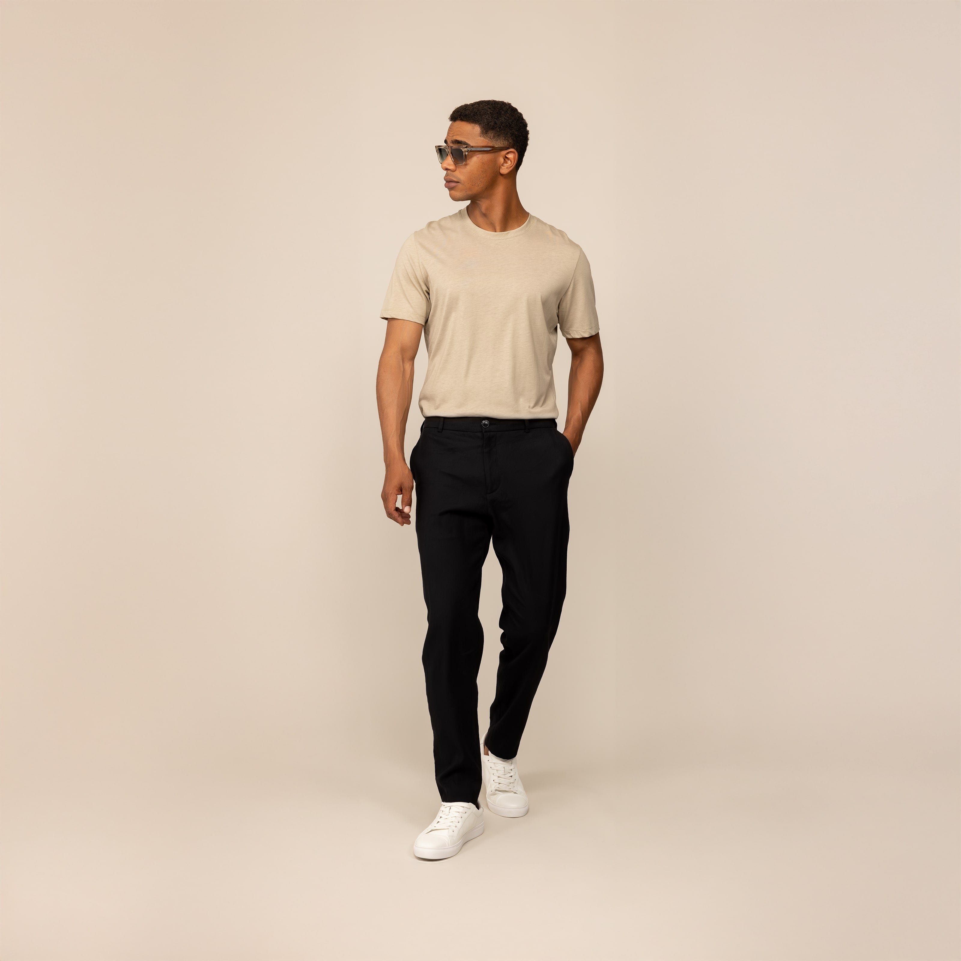 Man wearing Marame Casual Linen Blend Trousers in Black, front view.