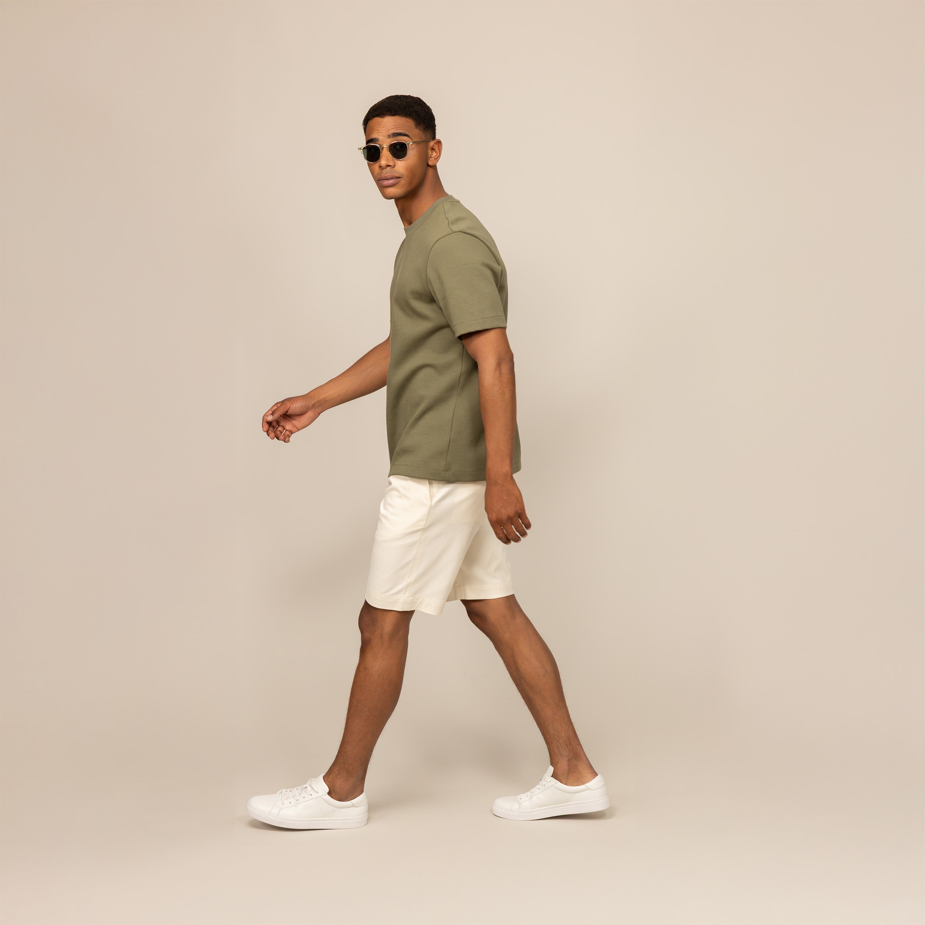Man wearing a Marame Relaxed Fit Logo T-Shirt in Olive, front view.