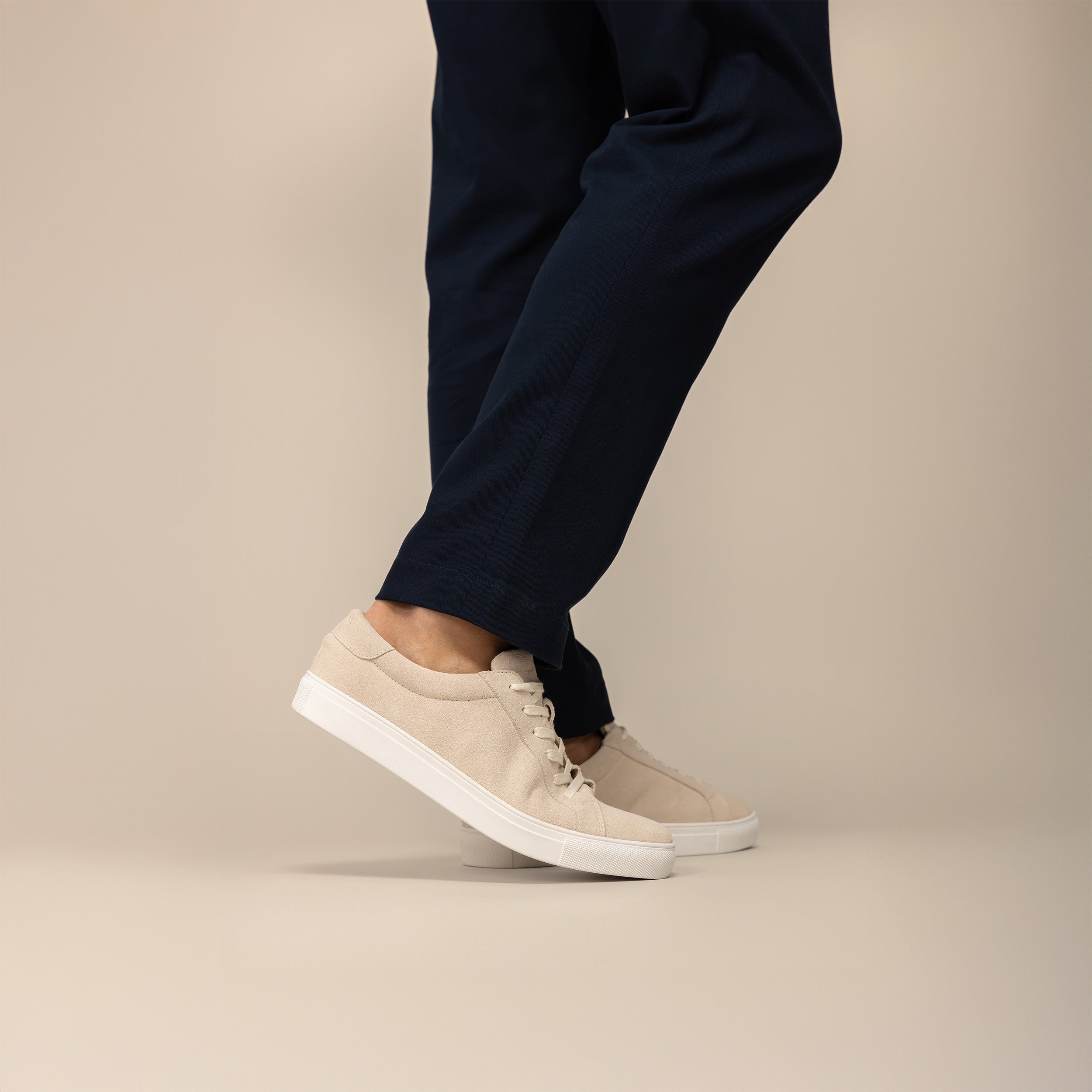 Man wearing a Marame Smart Suede Trainers in Grey, full view.