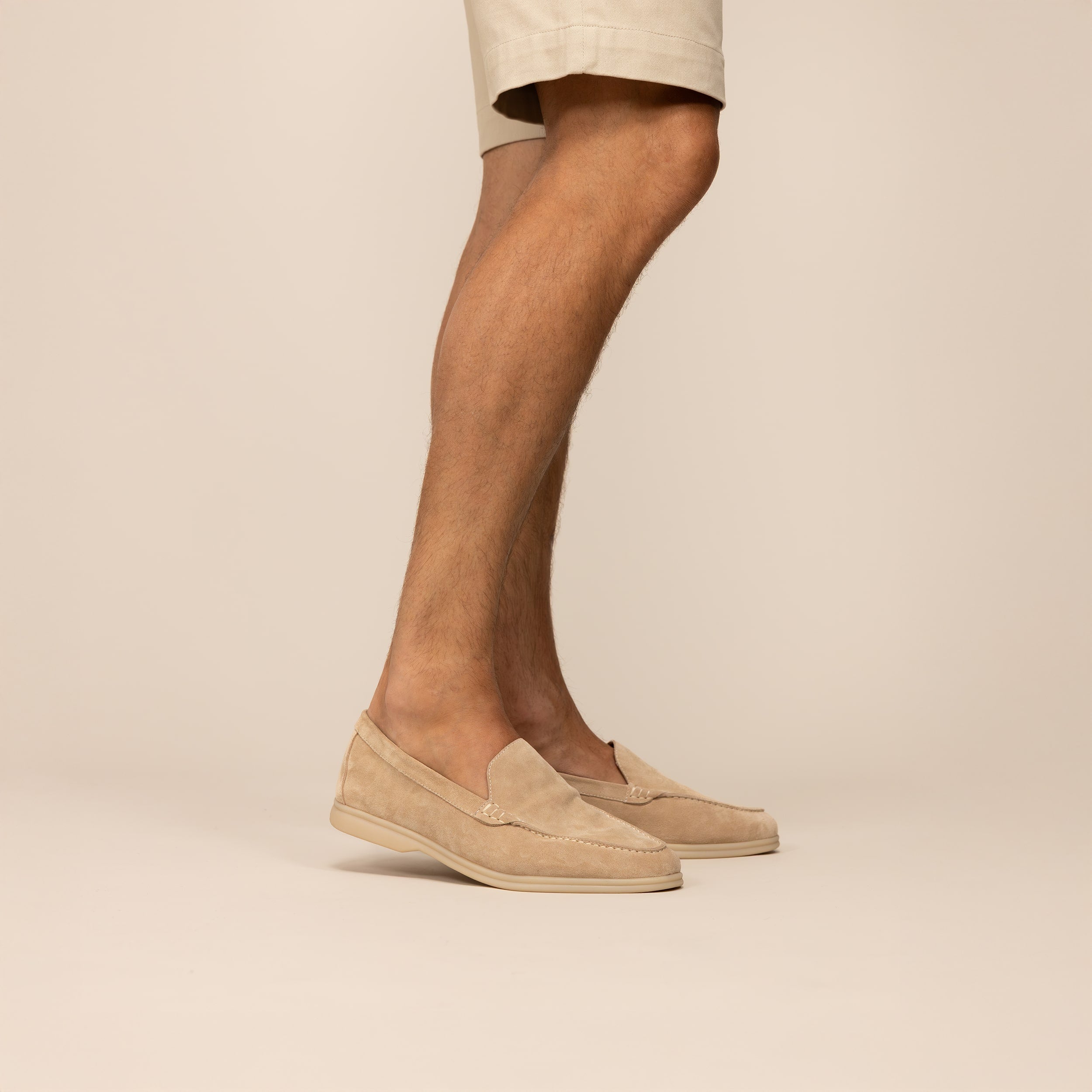 Man wearing Marame Suede Loafers in Sandstone, front view.