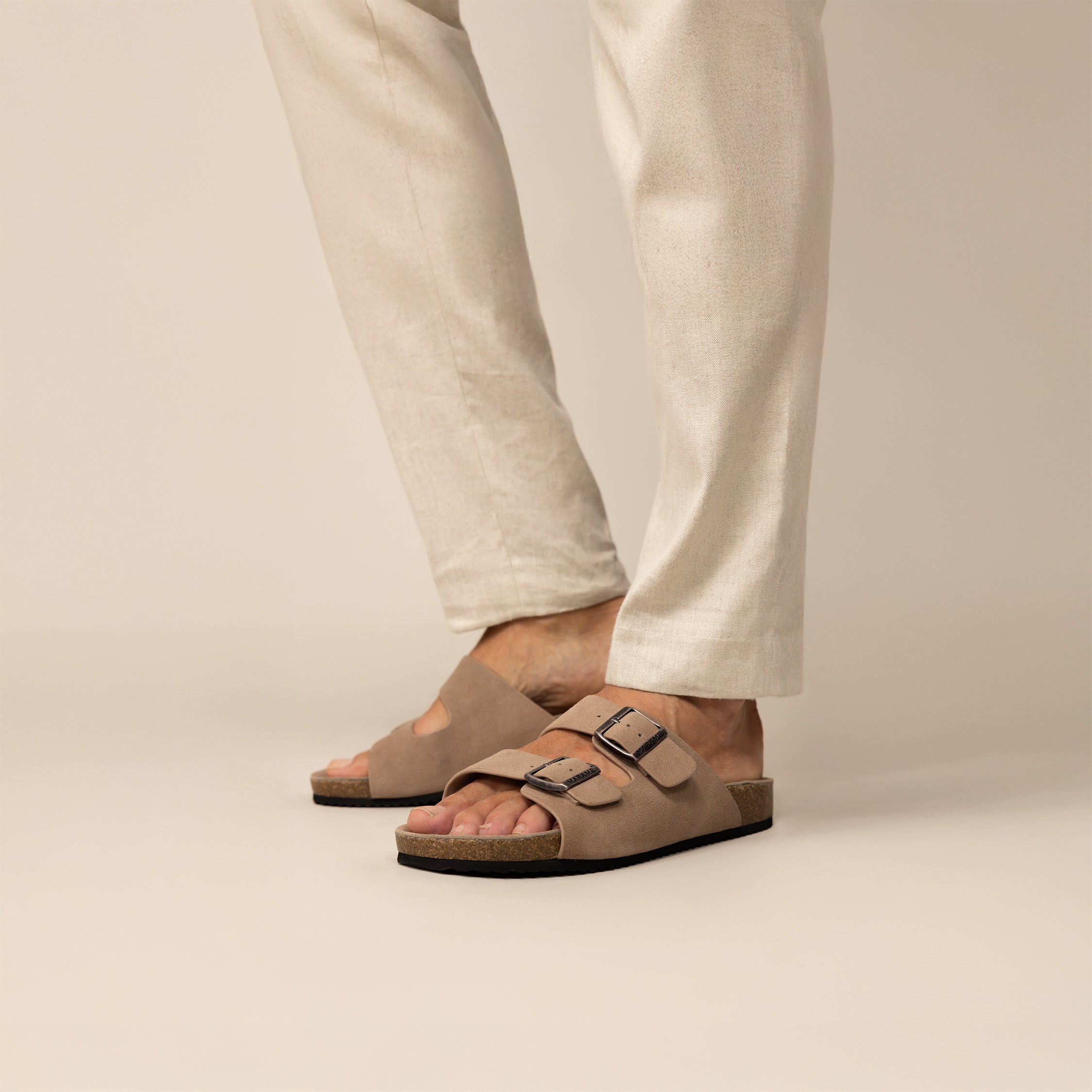 Man wearing Marame Suede Sandals in Clay, front view.