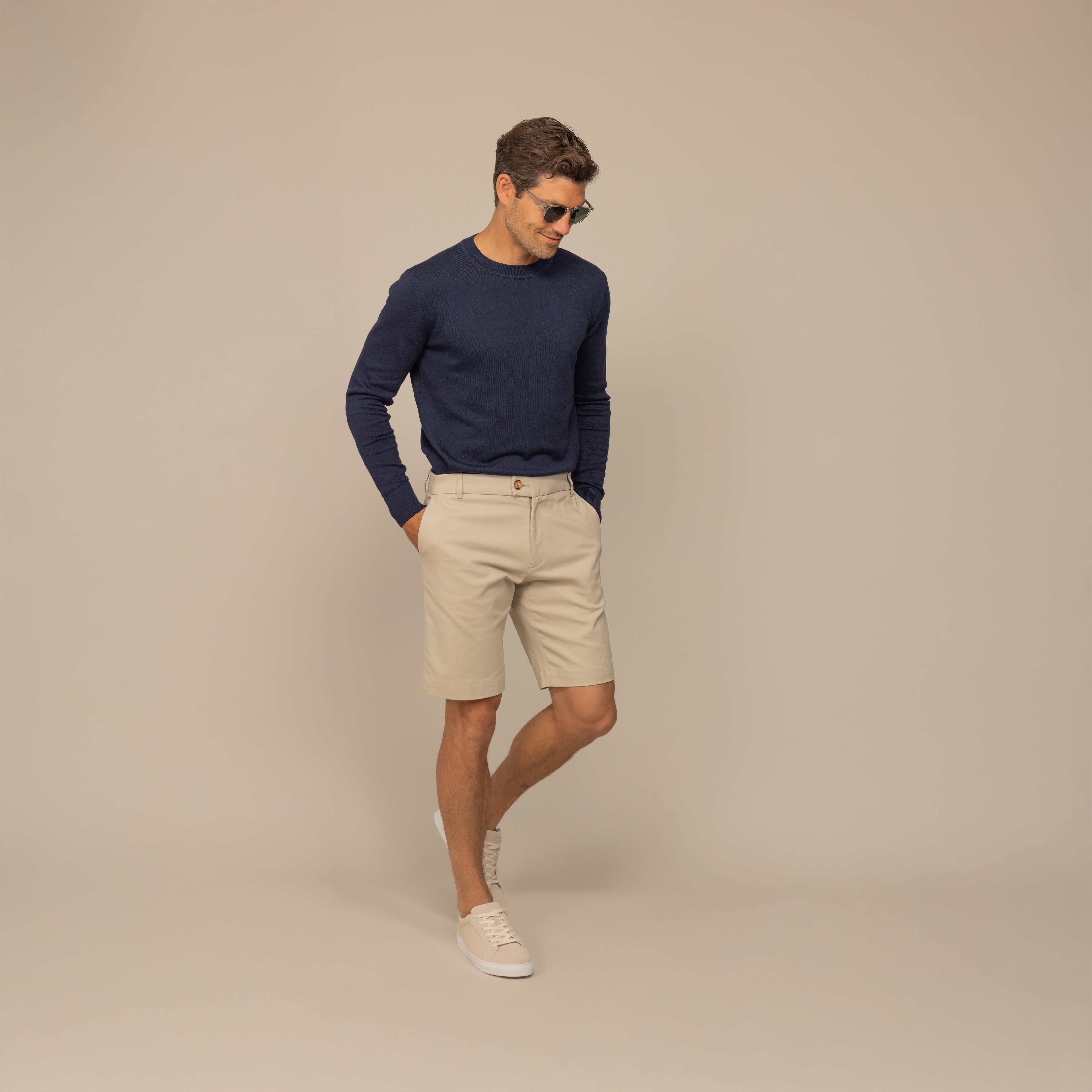 Man wearing a Marame Fine Knit Crew Neck Jumper in Navy, front view.