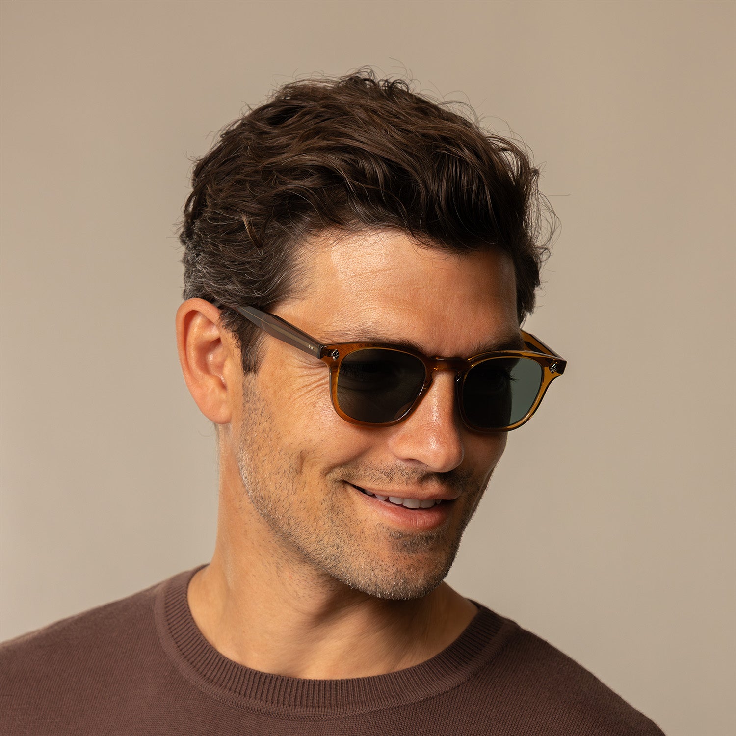 Man in Garrett Leight Ace Sun Sunglasses in Caramel, front view.