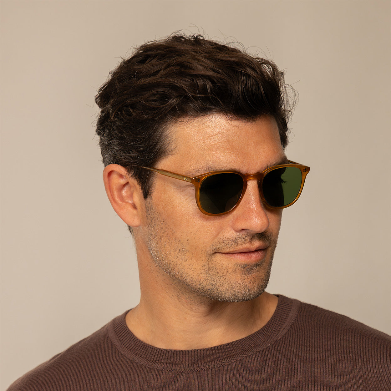 Man wearing Garrett Leight Kinney Sun Sunglasses in Butterscotch, front view.