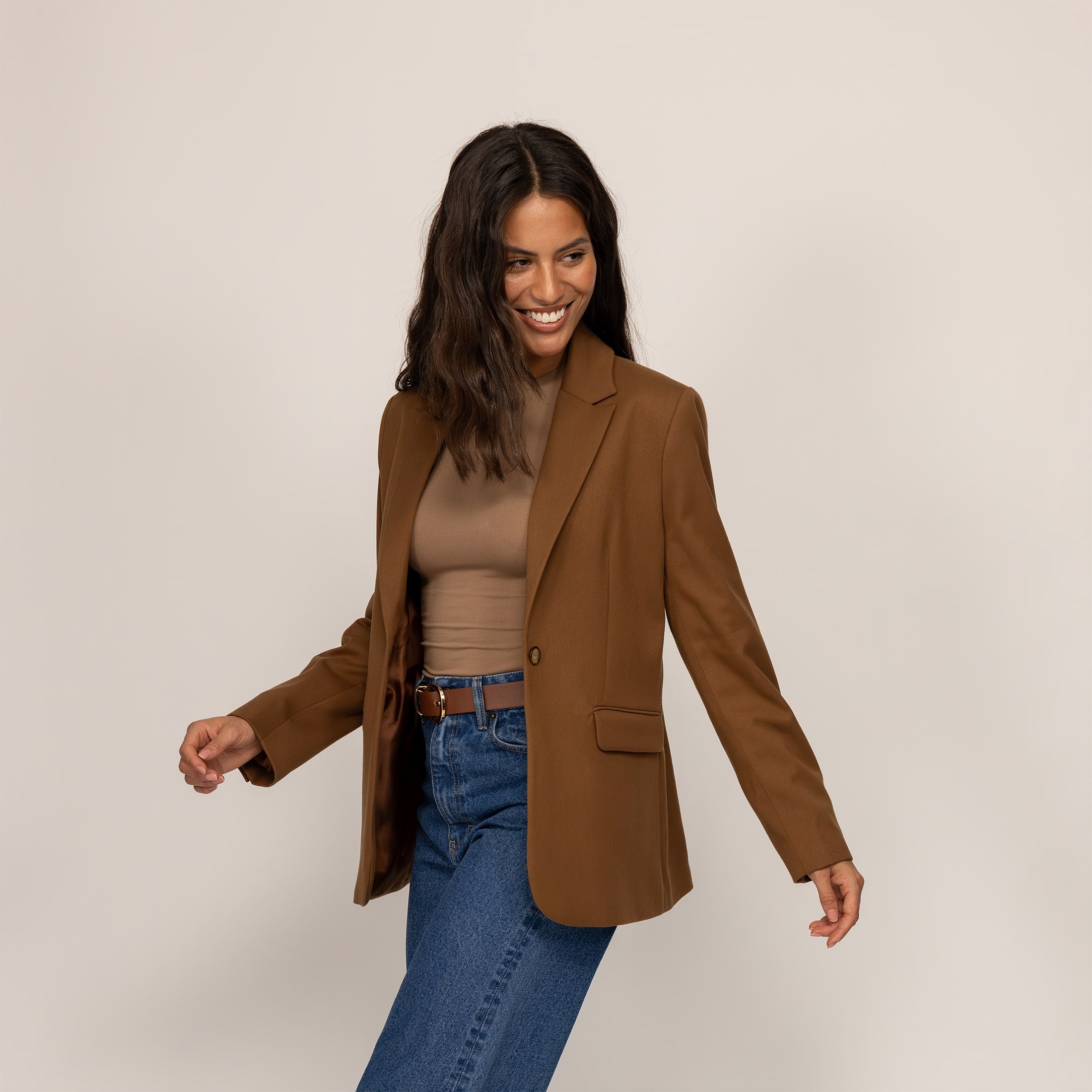 Woman wearing a Marame Classic Blazer in Brown Toffee, front view.