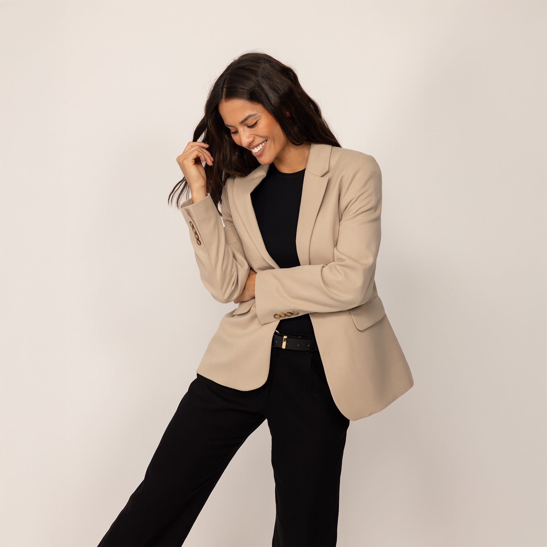 Woman wearing a Marame Classic Blazer in Natural Beige, front view.