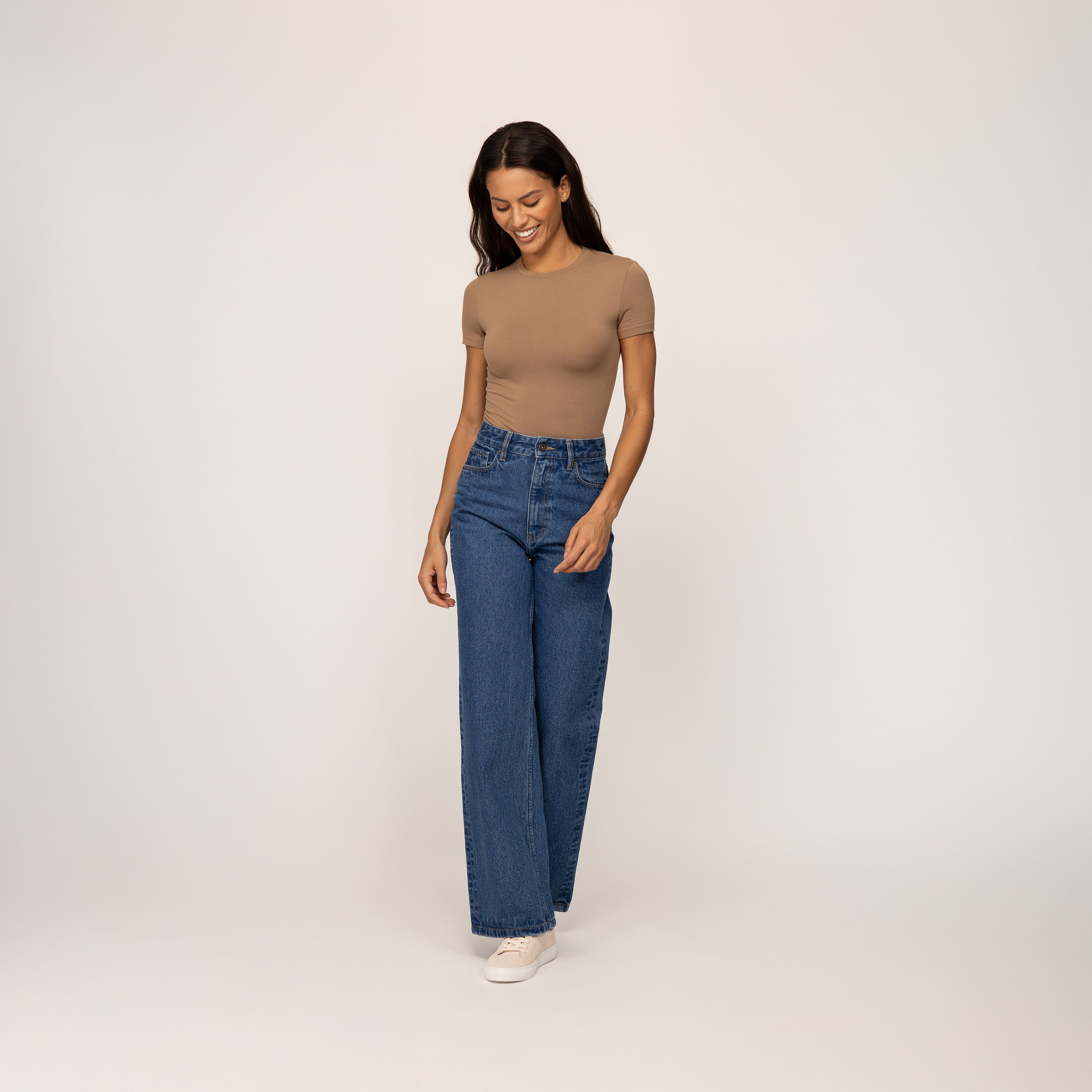 Woman wearing Marame High-Waisted Wide Leg Jeans in Deep Wash Navy Denim, full view.