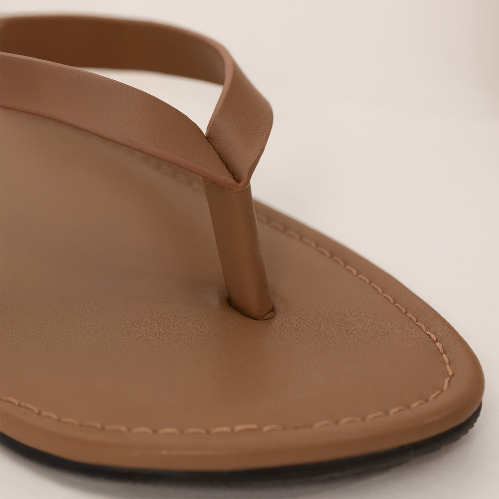 Marame Leather Flip Flops in Brown, closeup.