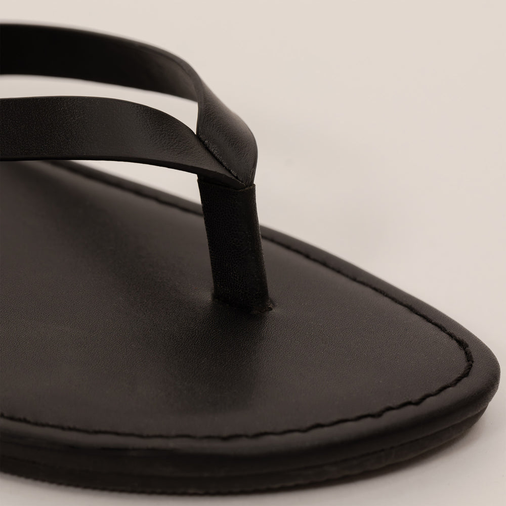 Marame Leather Flip Flops in Black, closeup.