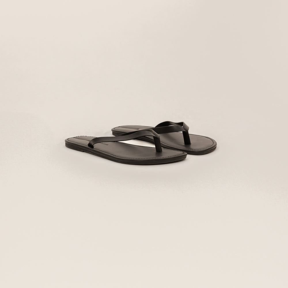 Marame Leather Flip Flops in Black, front view.