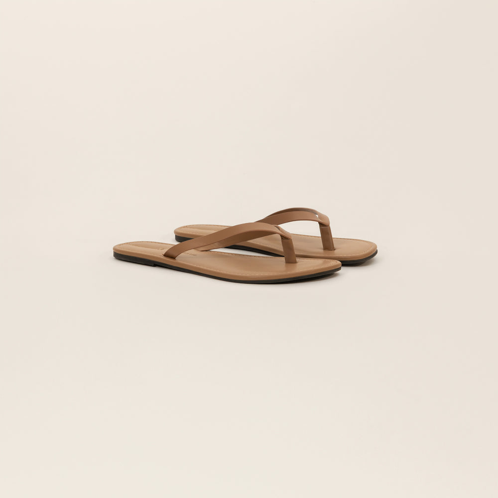 Marame Leather Flip Flops in Brown, front view.