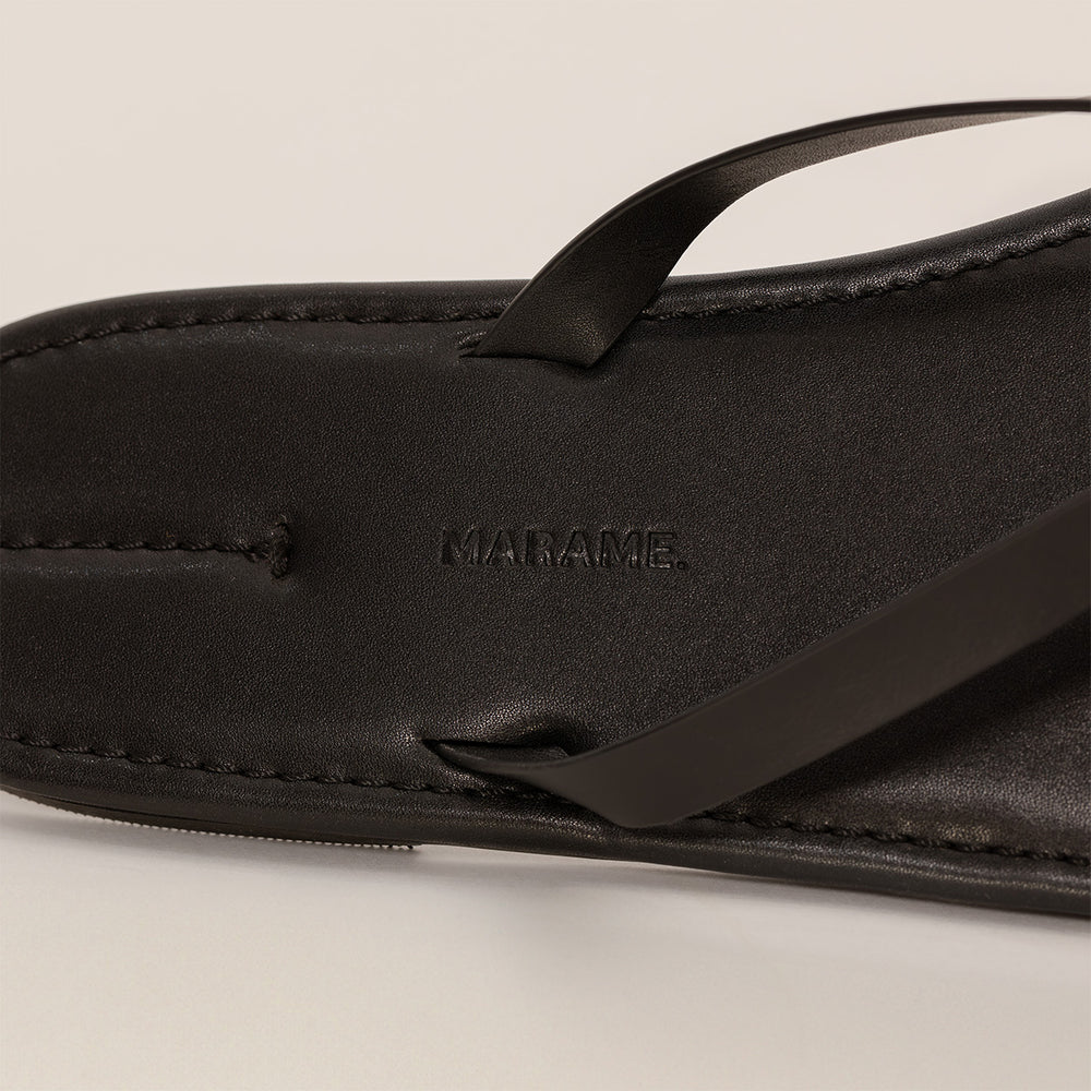 Marame Leather Flip Flops in Black, detail.