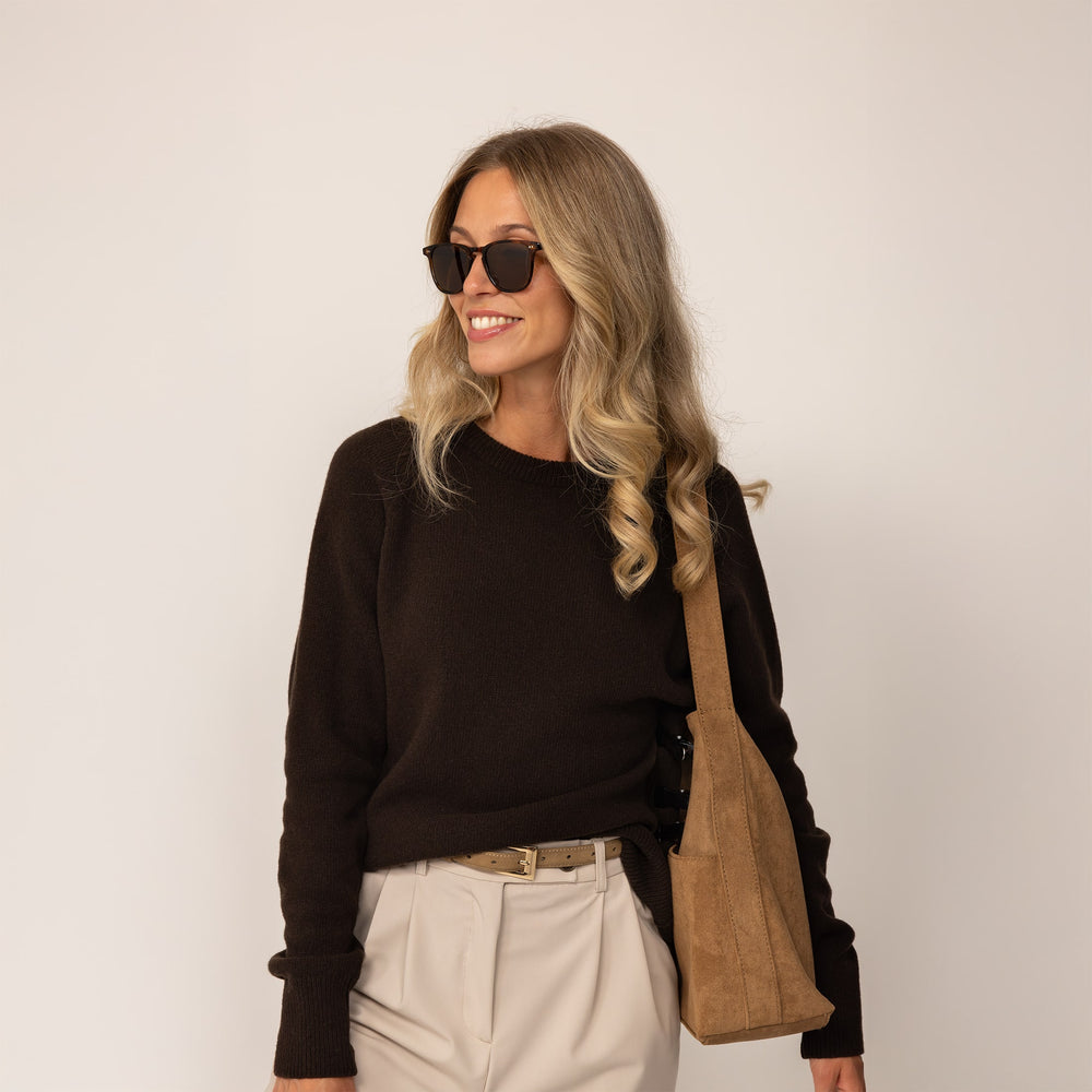 Woman wearing a Marame Merino Wool Crew Neck Jumper in Rich Chocolate, front view.
