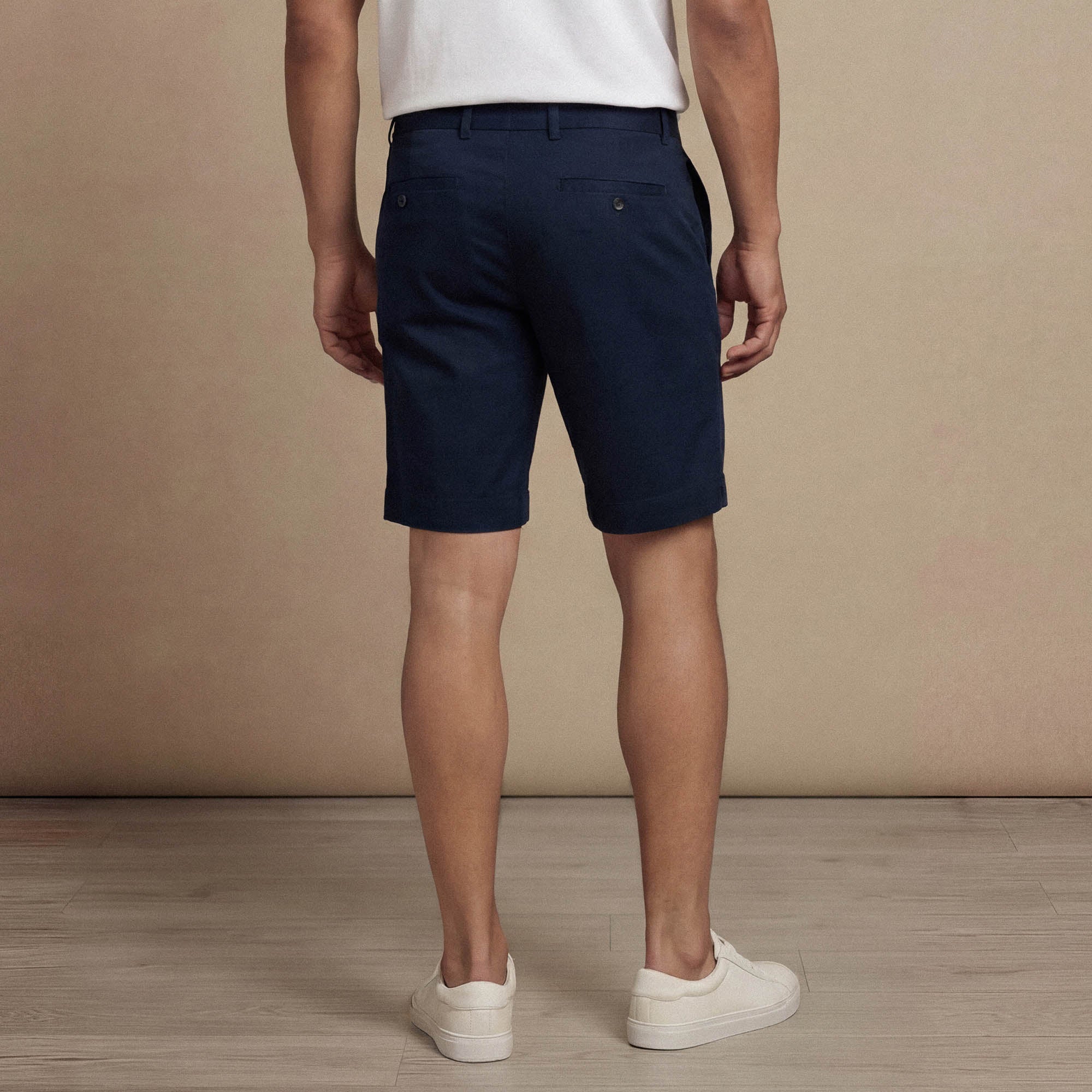 Man wearing Marame Chino Shorts in navy , back view. |navy