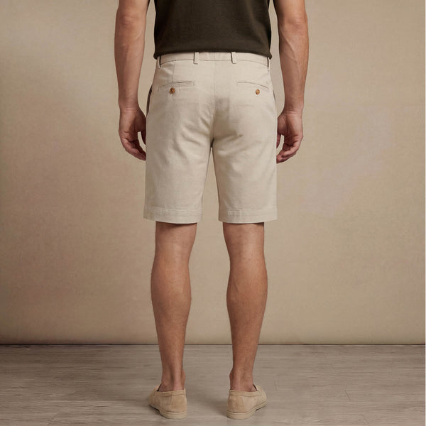 Man wearing Marame Chino Shorts in almond taupe back view. |almond taupe