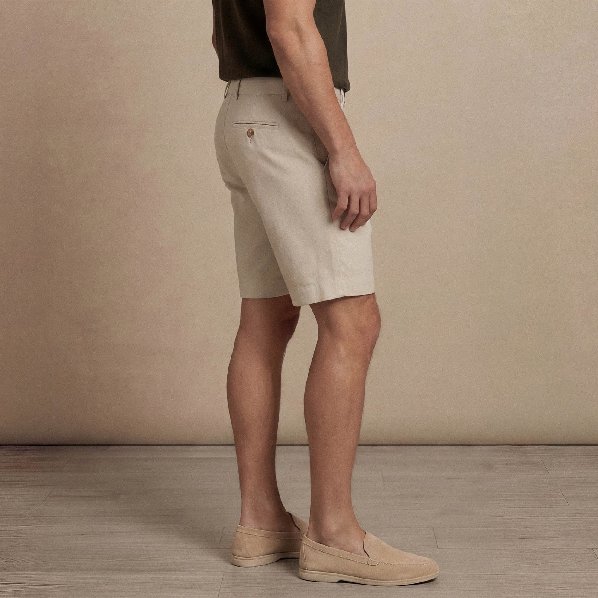 Man wearing Marame Chino Shorts in almond taupe side view. |almond taupe