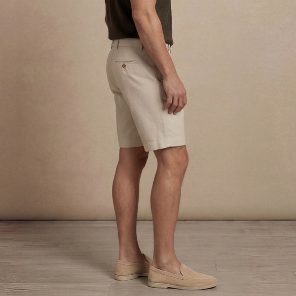 Man wearing Marame Chino Shorts in almond taupe side view. |almond taupe