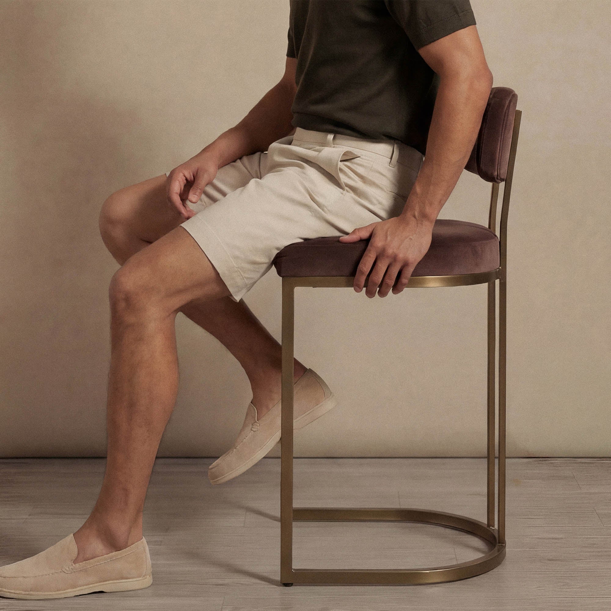 Man wearing Marame Chino Shorts in almond taupe seated view. |almond taupe