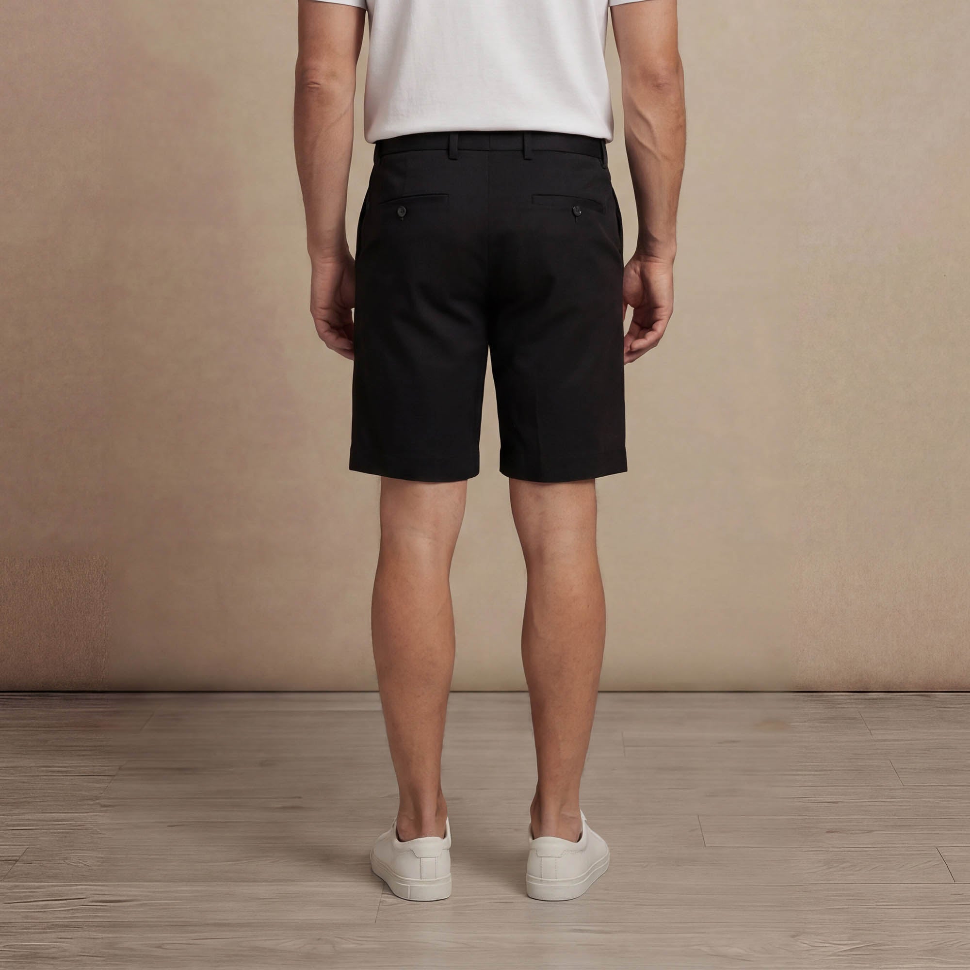 Man wearing Marame Chino Shorts in Black, back view. |black