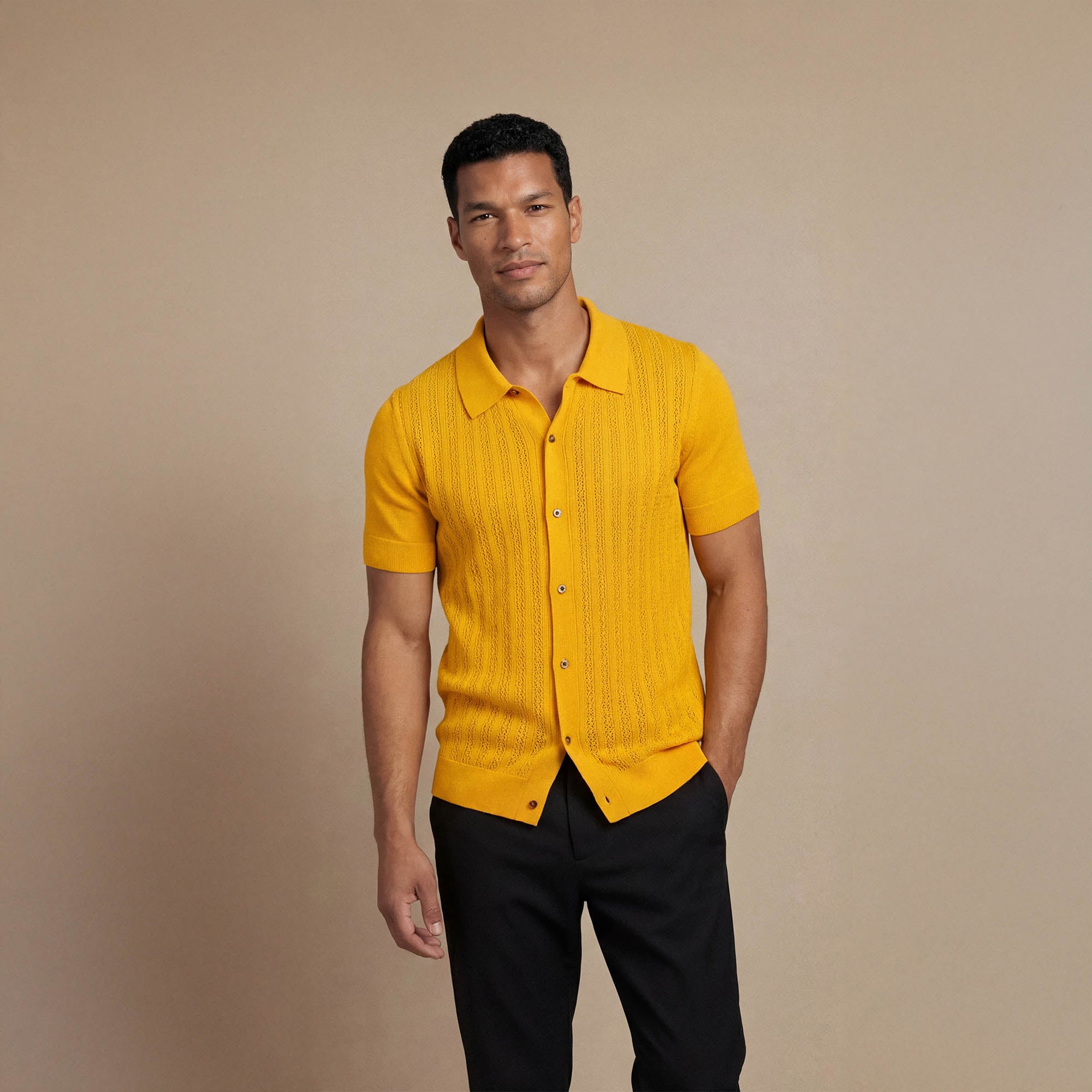 Man wearing Marame cabe knit shirt in citrus, front view. |citrus