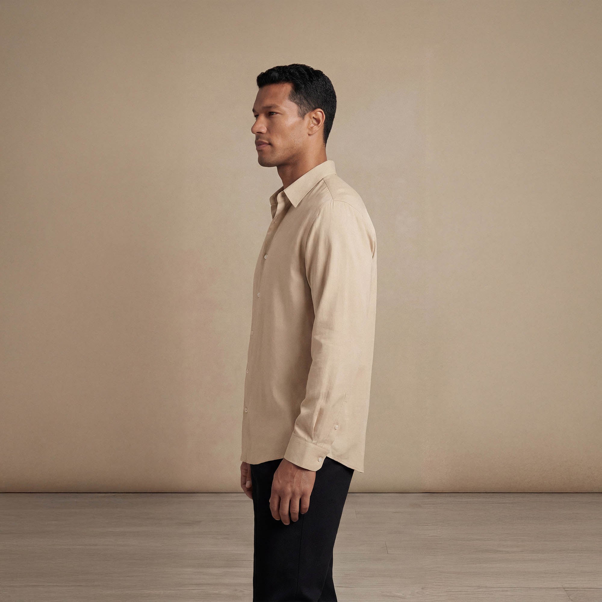 Man wearing Marame Lyocell/Linen Blend Casual Long Sleeve Shirt in Olive Grove, side view. |drift beige