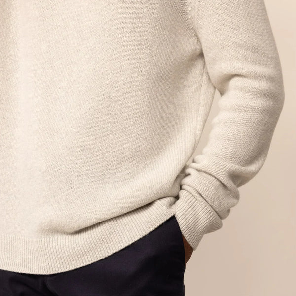 Man wearing a Marame Merino Wool Crew Neck Knit Jumper in Speckled Grey, closeup.