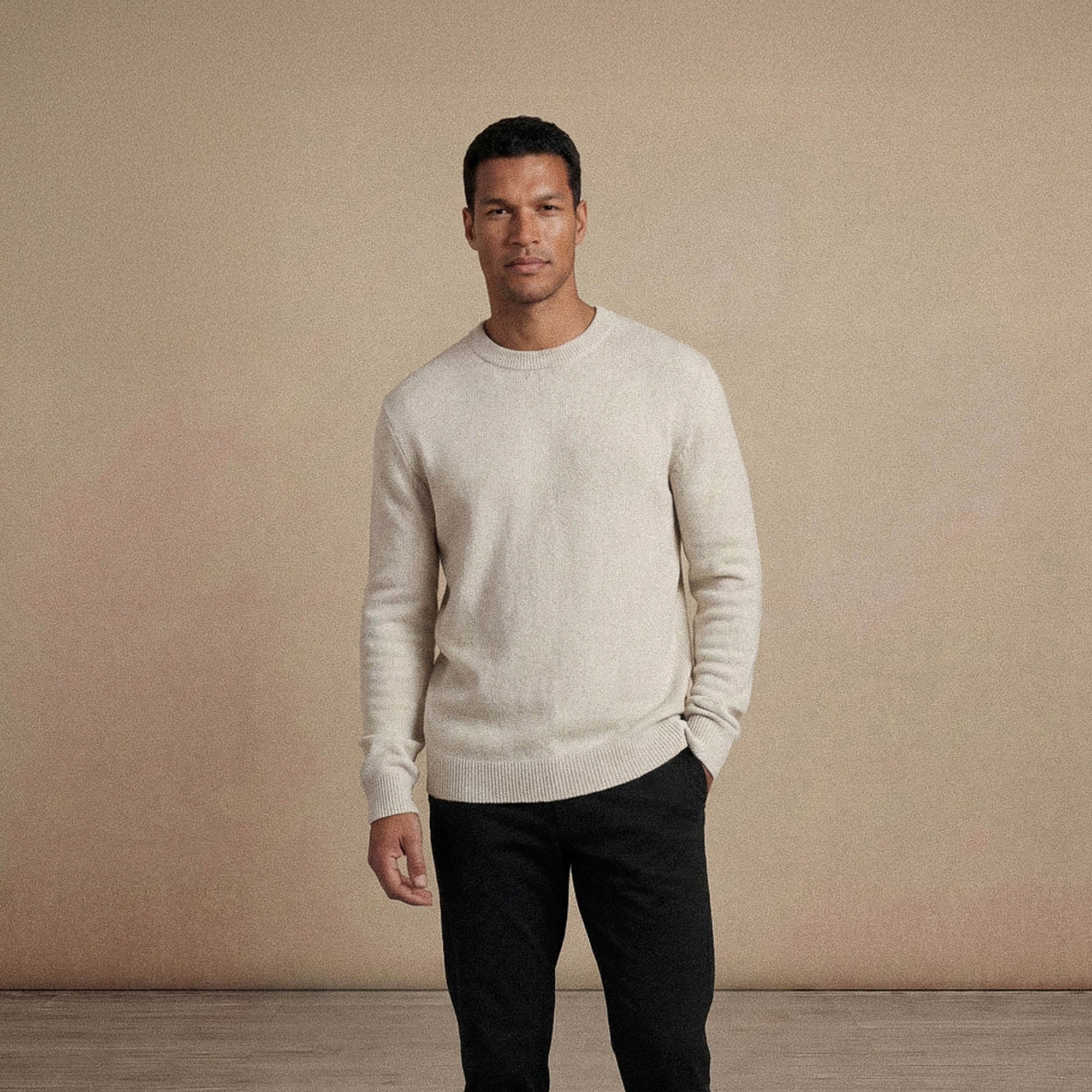 Man wearing a Marame Merino Wool Crew Neck Knit Jumper in front view.|speckled grey