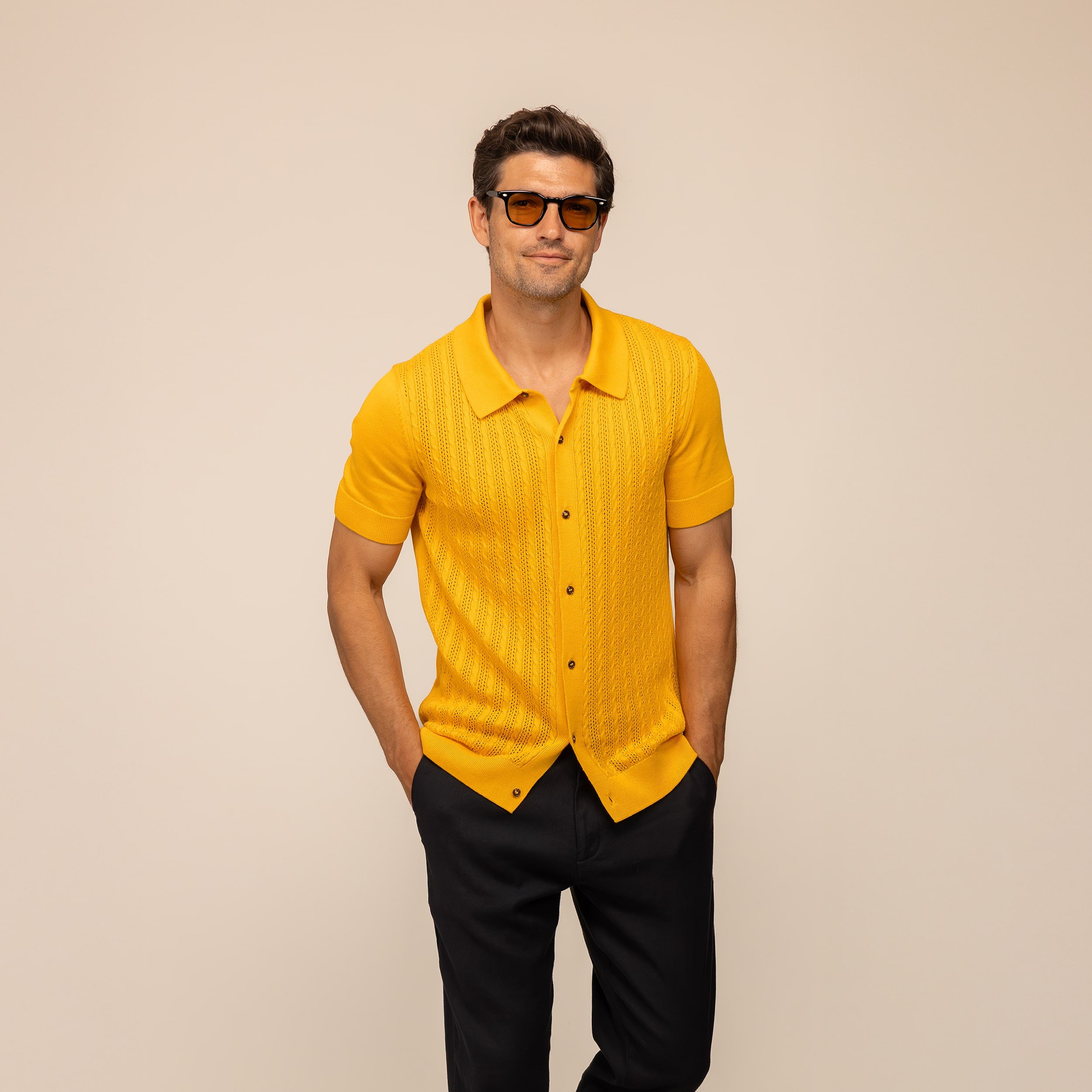 Man wearing Marame cabe knit shirt in citrus, front view.