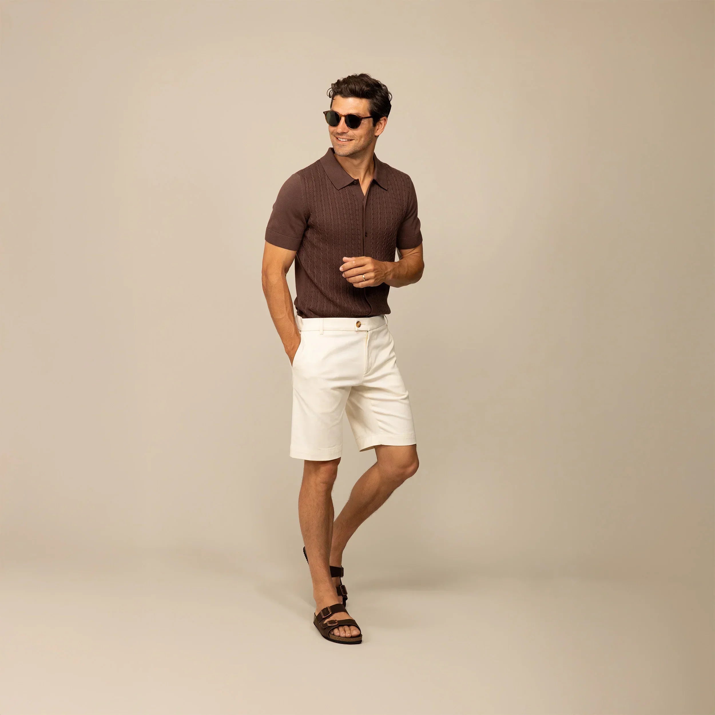 Man wearing Marame cable knit shirt in conker brown, front view. |conker brown