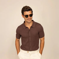 Man wearing Marame cable knit shirt in conker brown, front view. |conker brown