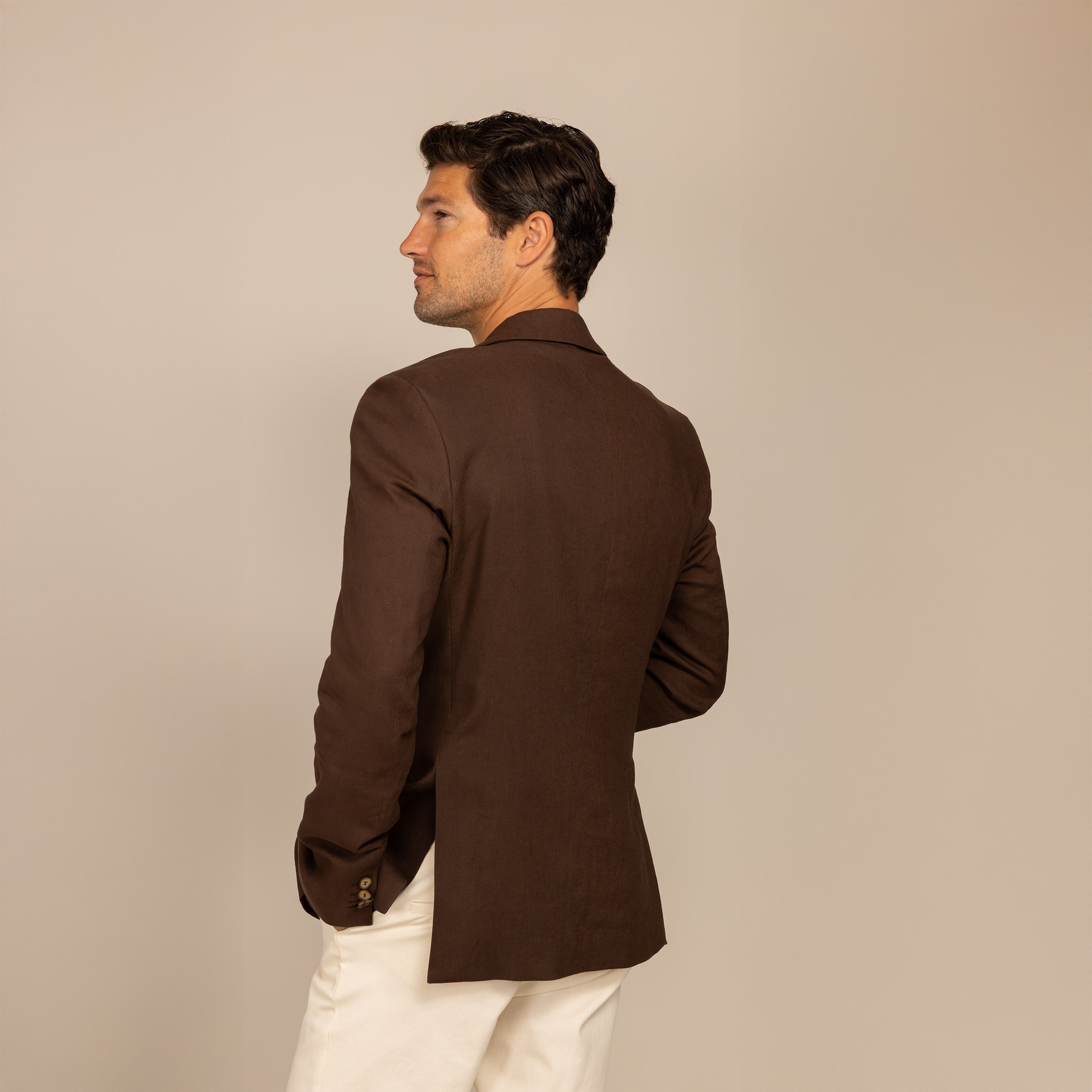 Man wearing a Marame Casual Blazer in Brown Linen, rear view.