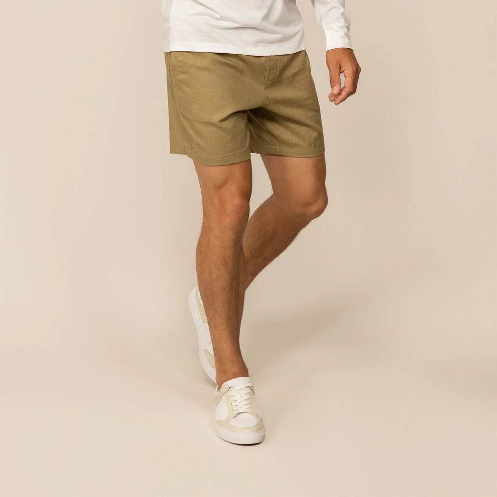 Man wearing Marame Casual Linen Blend Shorts in Barley Green, front view. |barley green