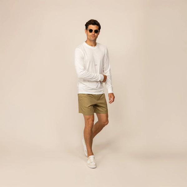 Man wearing Marame casual linen blend shorts in barley green, front view.