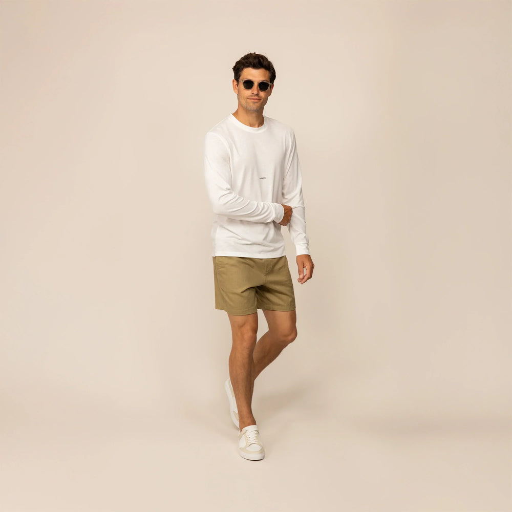 Man wearing Marame casual linen blend shorts in barley green, front view.