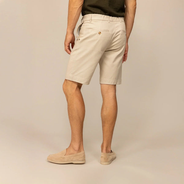 Man wearing Chino Shorts in Almond Taupe, rear view. |almond taupe