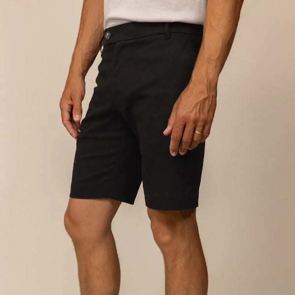 Man wearing Chino Shorts in Black, front view.