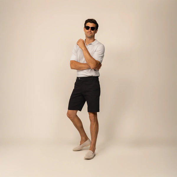 Man wearing Chino Shorts in Black, front view.