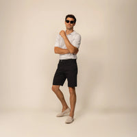 Man wearing Chino Shorts in Black, front view. |black