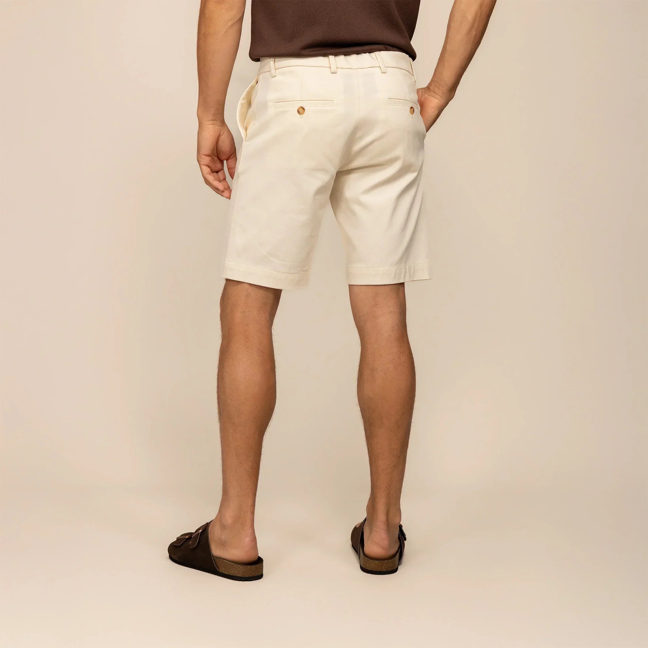 Man wearing Chino Shorts in Ivory Stone, rear view. |ivory stone