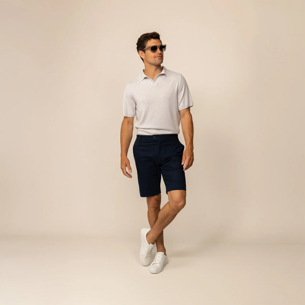Man wearing Marame Chino Shorts in Navy, front view.