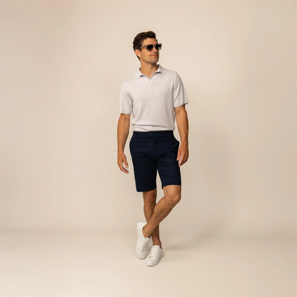 Man wearing Marame Chino Shorts in Navy, front view.