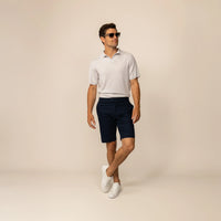 Man wearing Marame Chino Shorts in Navy, front view.