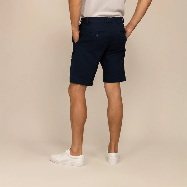 Man wearing Chino Shorts in Navy, rear view. |navy