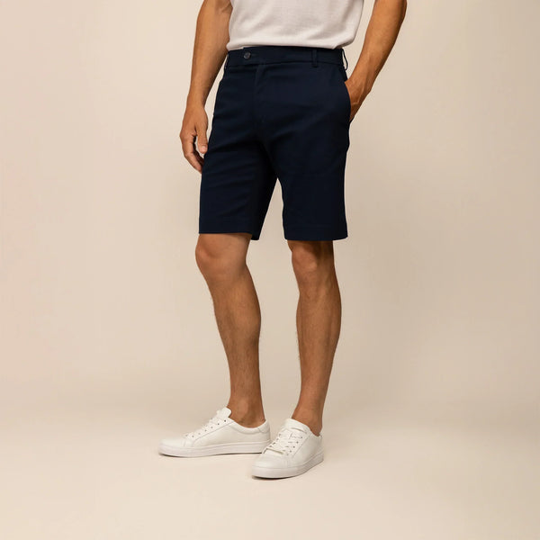 Man wearing Chino Shorts in Navy, front view.