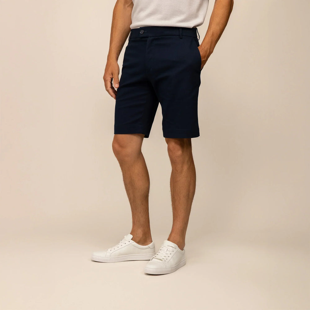 Man wearing Chino Shorts in Navy, front view.