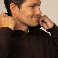 Man wearing a Marame cotton fleece hoodie in Smoked Brown, detail.